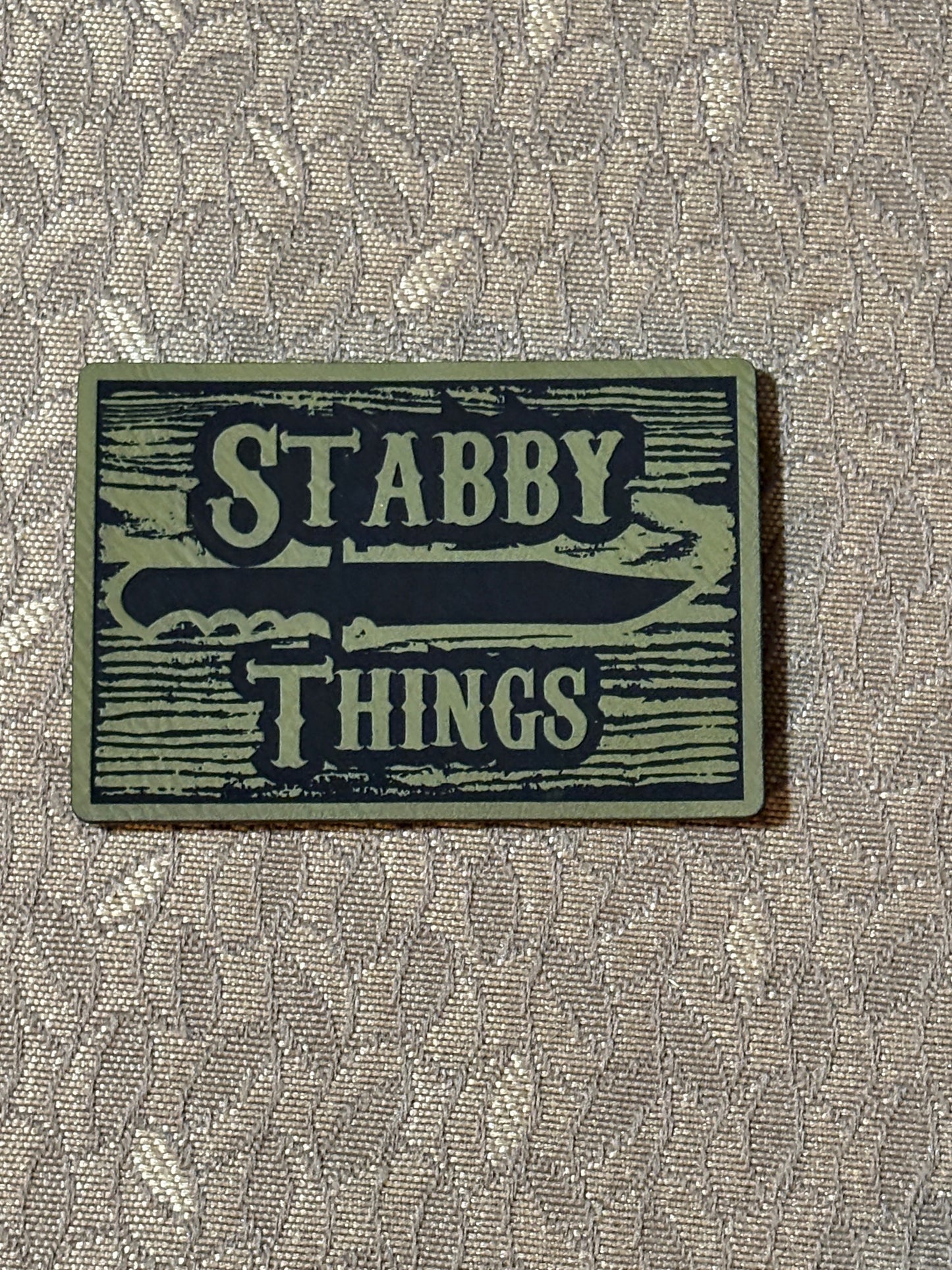 Stabby Things Woodgrain Morale Patch (OD Green, Hook and Loop Backing)